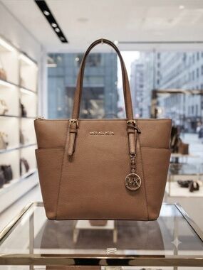 Michael Kors Jet Set Travel
Saffiano LeatherTote in 
Luggage Brown EUC like new!